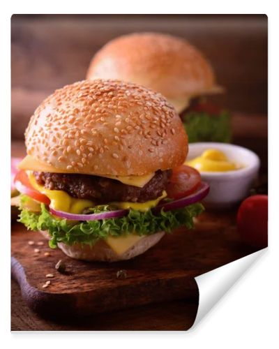 Fresh burger closeup. Wooden rustic background. Top view