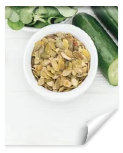 top view of tasty fruits and vegetables in bowls near glass jars on wooden white table with copy space, panoramic shot