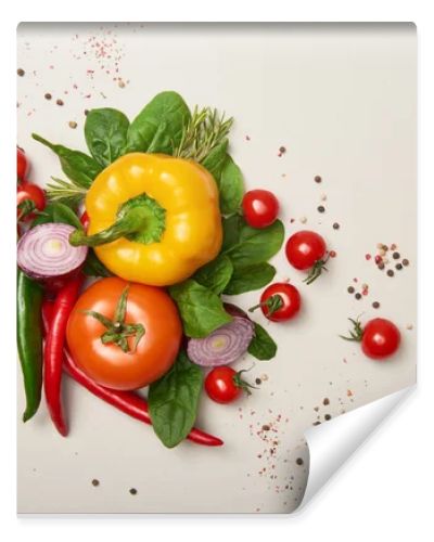 Top view of fresh vegetables and spices on grey background