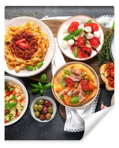 Italian food dishes on dark background. Traditional food concept. Top view.