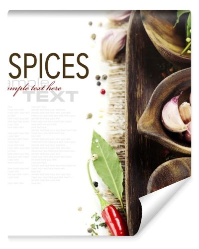 Wooden bowls with fresh herbs and spices
