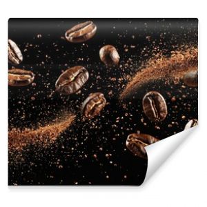 Dynamic coffee beans in mid-air with swirling ground coffee on a black background capturing energy motion and the essence of fresh brew