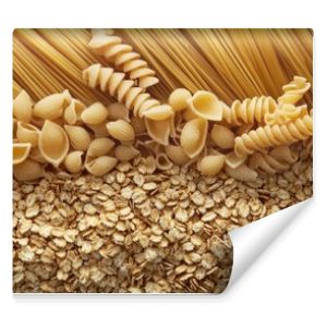 Wallpaper featuring a background of cereal showcases raw pasta, blending the textures and visuals of cereal and uncooked pasta in a unique design for a captivating effect.