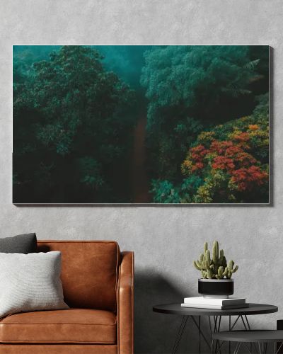 Gentle mist wraps around a serene forest path lined with vibrant autumn colors.
