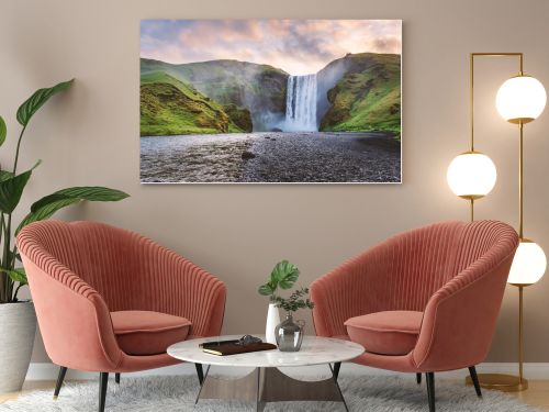 Famous Skogafoss waterfall on Skoga river in sunrise time