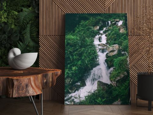 amazing waterfall with rocks and green plants in indian himalayas