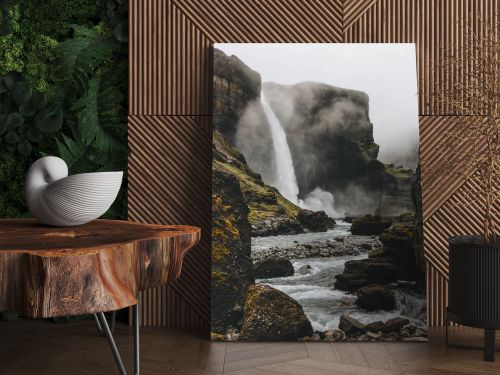 dramatic icelandic landscape with Haifoss waterfall on misty day