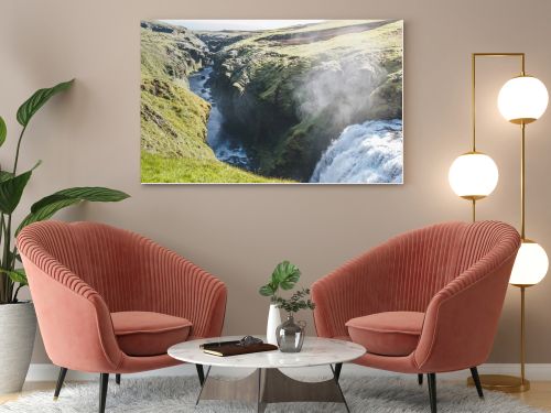 aerial view of waterfall on Skoga river flowing through highlands in Iceland