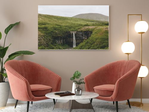 distant view of Svartifoss (Black fall) waterfall in Iceland 