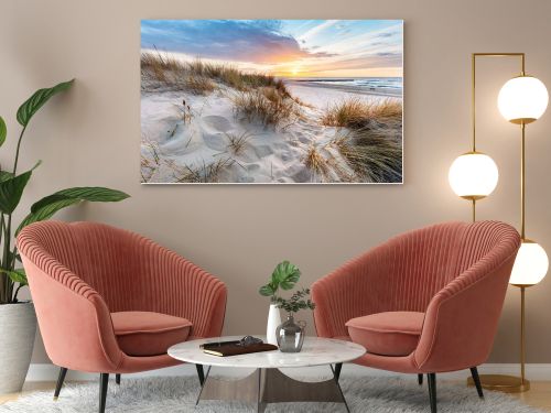 Beach grass on dune, Baltic sea at sunset. Calm landscape