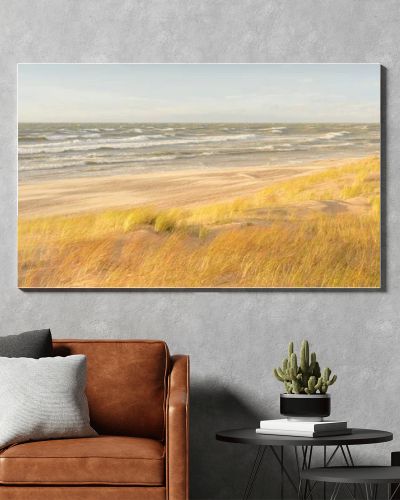 Baltic sea coast (sand dunes) after the storm at sunset. Clear sky, glowing clouds, wind. Autumn landscape. Nature, environmental conservation, ecology, ecotourism, local travel