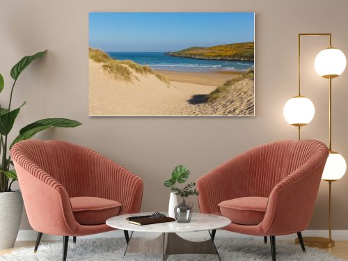 Sand dunes Crantock beach North Cornwall England UK near Newquay and on the South West Coast Path in spring with blue sky and sea