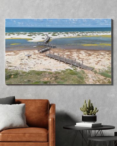 Coastal Wetland Landscape With Wooden Walkway And Sand Dunes in Mari Ermi Cabras