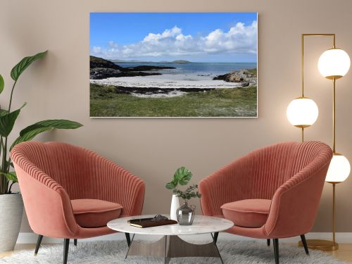 Beautiful sandy beach with coastal dunes on the remote island of South Uist in the Outer Hebrides of Scotland.