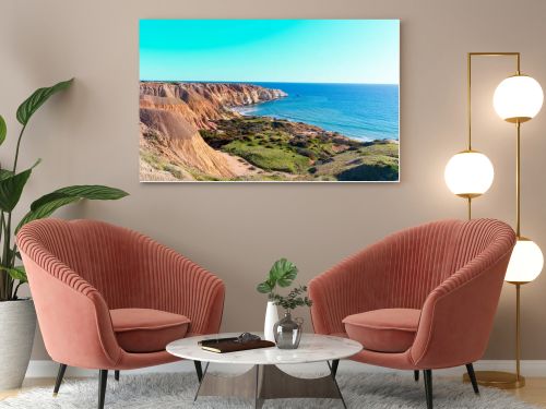 Maslin Beach, located 42 km south of Adelaide on South Australias Fleurieu Peninsula, is renowned for its pristine white sands, clear turquoise waters, and dramatic ochre cliffs. As Australias first legal clothing-optional beach, established in