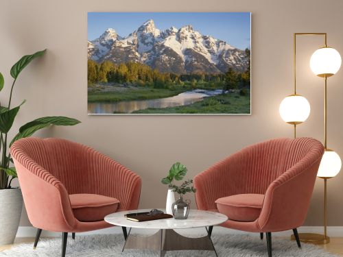 Grand Teton mountains with stream in morning light