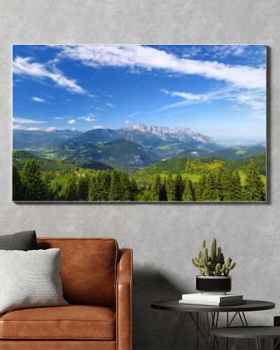 Scenic view of mountains, forests and blue sky