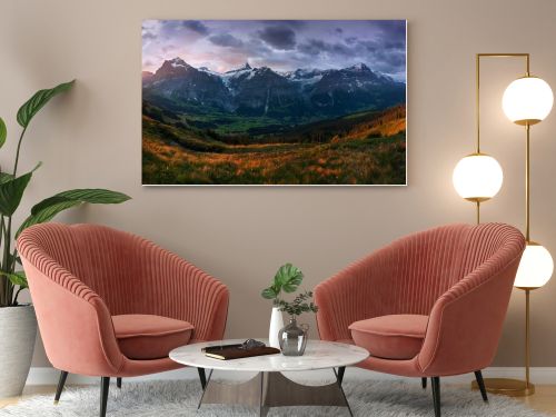 scenic view of fields and mountains under overcast sky