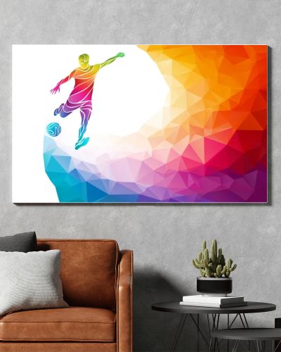 Creative silhouette of soccer player. Football player kicks the ball in trendy abstract colorful polygon rainbow back