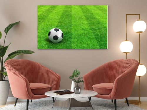 Green striped football field with soccer ball