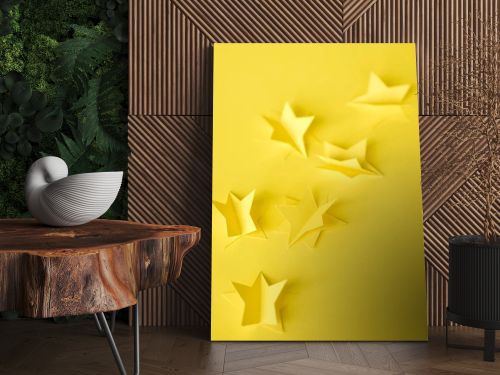 selective focus of paper stars on yellow 