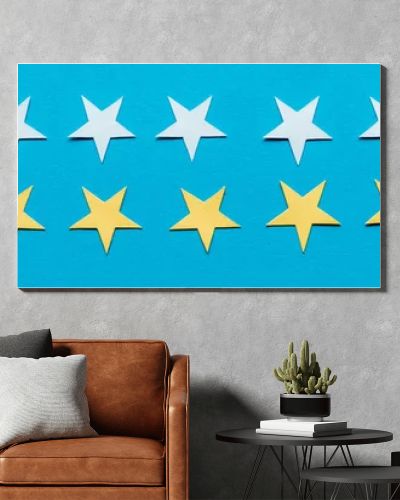 panoramic shot of yellow and white stars isolated on blue