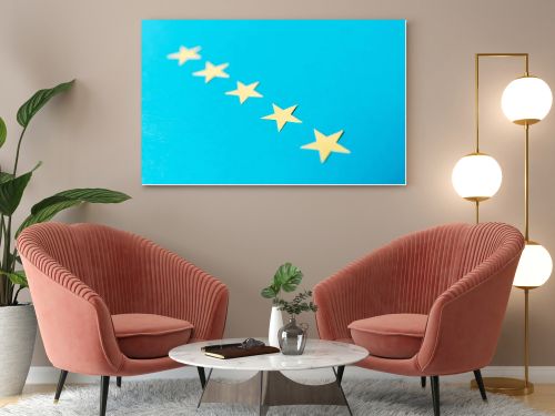 selective focus of yellow stars isolated on blue with copy space