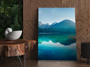 Colorful summer view of Fusine lake. Bright morning scene of Julian Alps with Mangart peak on background, Province of Udine, Italy, Europe. Traveling concept background.