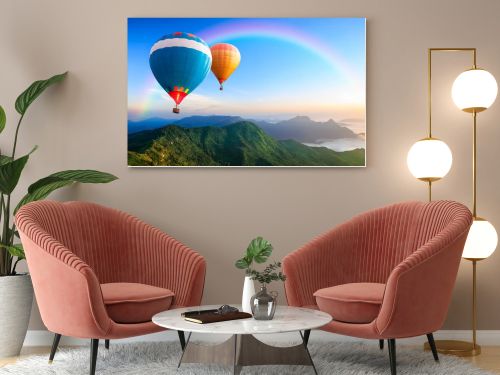 Colorful hot-air balloons flying over the mountain