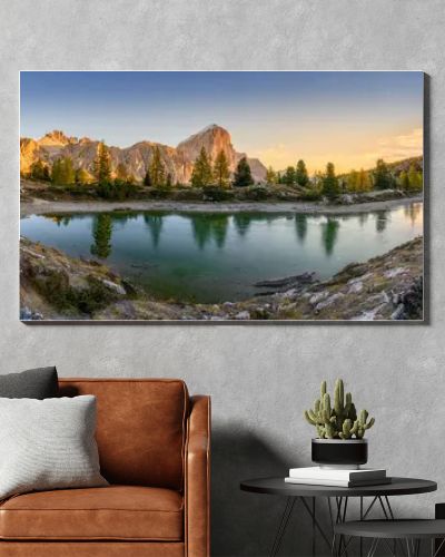 Panorama of the lake Lago di Limedes with the reflection of the surrounding mountains