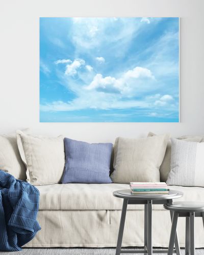 Clear blue sky and white clouds summer background.