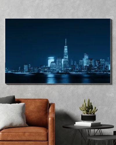 New York City skyline with skyscrapers over Hudson River viewed from New Jersey at night