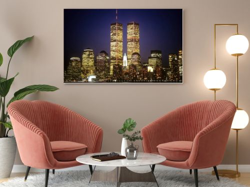 New York City skyline with the World Trade Center towers at night. Horizontal shot.