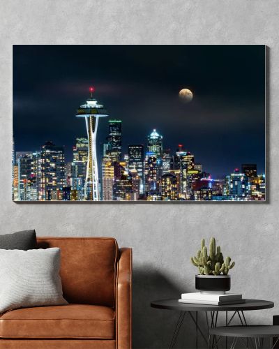 Full moon rises above Seattle skyline, as viewed by night from Kerry Park.