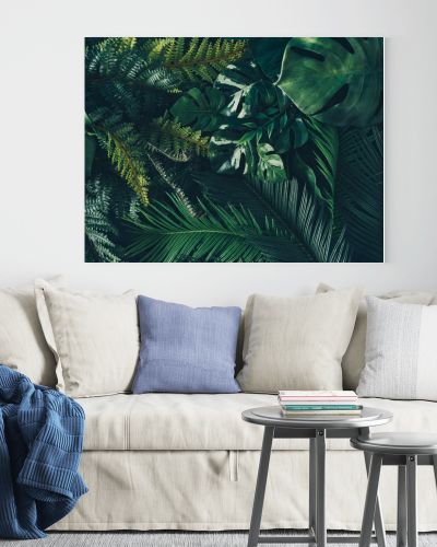 Creative nature background. Green tropical palm leaves. Minimal summer abstract jungle or forest composition. Contemporary style.