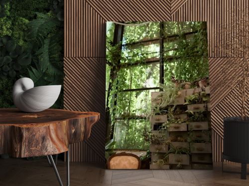 An abundance of lush green plants alongside neatly stacked boxes in a vibrant room.