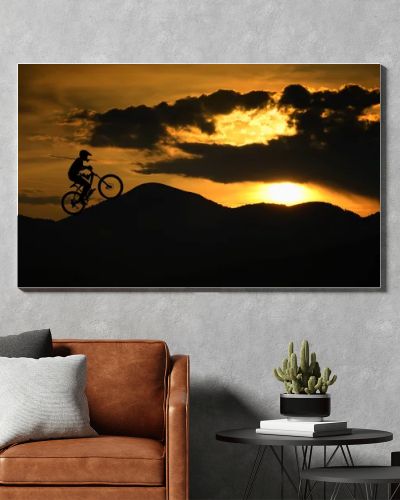 Silhouette of biker at sunset