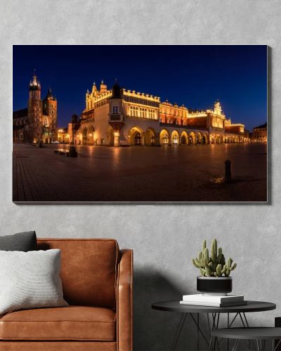 Cloth Hall Sukiennice building and main square of the old town illuminated at night on main square of Cracow. Poland  Panoramic view
