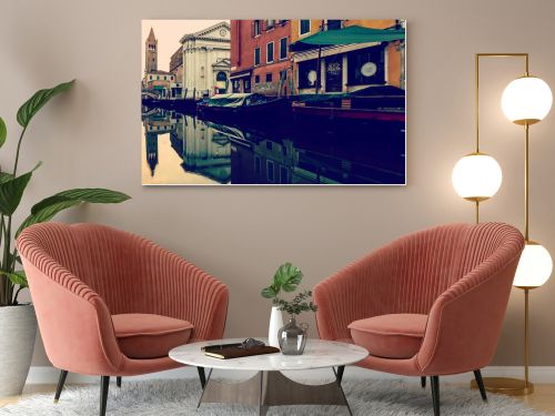 beautiful canal with boats in Venice