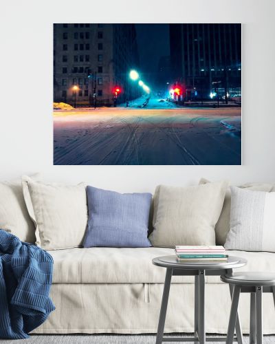 Horizontal shot of an illuminated crossroad in downtown Montreal, Canada during the night