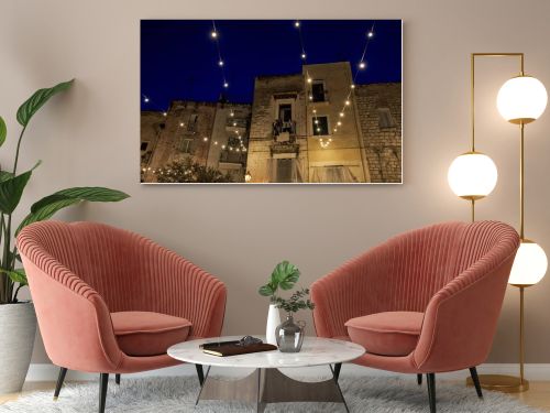  Night view in amazing Old Town , historical center of Bari , Italy. Street Casamassimi .