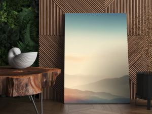 Dreamy mountains with autumn background during sunset or sunrise. Elegant and minimalistic style wallpaper with copy space in orange, yellow colors.