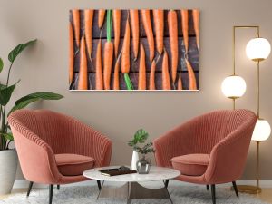 Carrot overhead group lined up on old rustic brown wooden table in studio