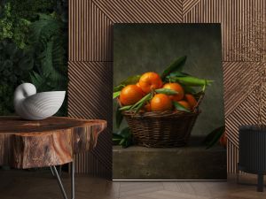 Still life with tangerines in a basket on the table