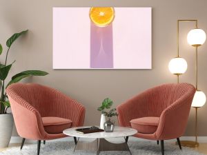 Glass of drink with orange on a pink background. Aesthetic long shadow glass summer concept.