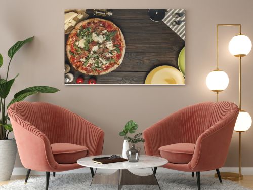 flat lay with arranged italian pizza, cutlery and various ingredients on wooden surface