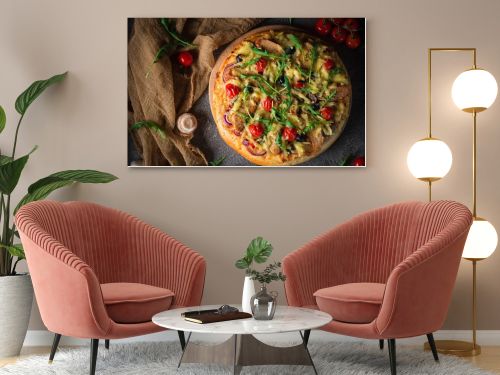 Pizza with chicken, arugula, cheese and onions on wooden rustic table. Top view