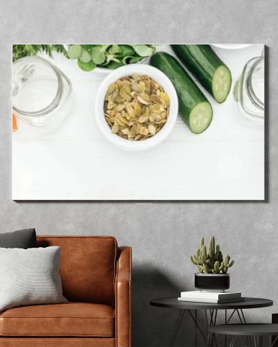 top view of tasty fruits and vegetables in bowls near glass jars on wooden white table with copy space, panoramic shot