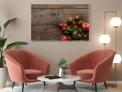 top view of tomatoes with spinach on wooden table 