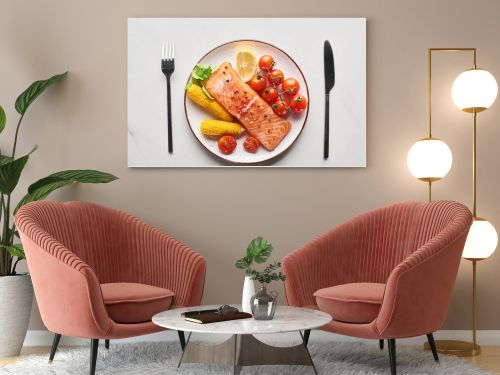 top view of raw salmon steak served with corn and tomatoes on plate near cutlery on marble table